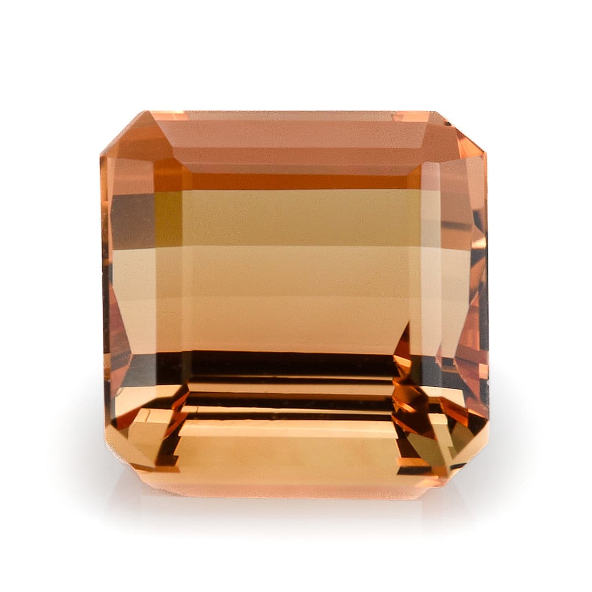 Cushion cut Imperial Topaz gemstone showcasing warm orange-brown hues.