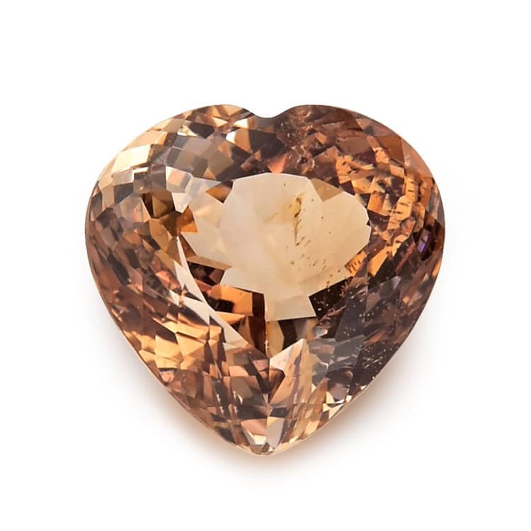 Heart-shaped Imperial Topaz gemstone with warm orange-brown hues.